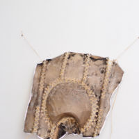 Corset. De la serie cueros disecados. Tecnica textil(Cuero crudo de oveja, tiento y apliques). 65x 50 cm. 2018